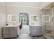 Primary bathroom with dual vanities, modern mirrors, and a glass-enclosed shower at 422 Laurian Nw Way, Kennesaw, GA 30144