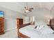 Main bedroom featuring a vaulted ceiling, fan, and a view to the hallway sitting area at 422 Laurian Nw Way, Kennesaw, GA 30144