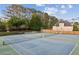 Community tennis courts with lush trees, providing recreational opportunities for residents at 422 Laurian Nw Way, Kennesaw, GA 30144