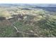 Breathtaking aerial shot of a house nestled in a serene landscape with a winding driveway and abundant greenery at 7746 Tyree Rd, Winston, GA 30187