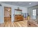 Spacious basement with hardwood floors, vintage dresser, and a glass door to the outside at 7746 Tyree Rd, Winston, GA 30187