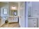 White bathroom featuring a tub, vanity, and a separate sink area at 7746 Tyree Rd, Winston, GA 30187