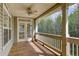 Charming porch has access to the backyard and a ceiling fan to keep you cool at 7746 Tyree Rd, Winston, GA 30187