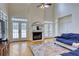 Bright living room with fireplace, hardwood floors, and French doors to the outside at 7746 Tyree Rd, Winston, GA 30187