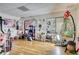 Large room with hardwood flooring, playful decor, and ample storage at 7746 Tyree Rd, Winston, GA 30187