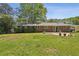 A lush backyard with beautiful green grass, a patio and mature trees at 2419 Little John Se Trl, Marietta, GA 30067