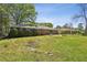 Spacious backyard with patio and mature trees, perfect for outdoor entertaining at 2419 Little John Se Trl, Marietta, GA 30067