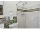 Bathroom featuring white subway tile and colored tile accents at 2419 Little John Se Trl, Marietta, GA 30067