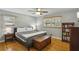 Comfortable bedroom with hardwood floors and natural light from two windows at 2419 Little John Se Trl, Marietta, GA 30067