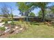 Charming brick home featuring a bright blue front door, lush greenery, and mature trees creating a welcoming curb appeal at 2419 Little John Se Trl, Marietta, GA 30067