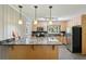 Well-equipped kitchen featuring granite countertops, stainless steel appliances, and ample cabinet space for storage at 2419 Little John Se Trl, Marietta, GA 30067