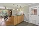 Eat-in kitchen with island featuring granite countertop and wood cabinets at 2419 Little John Se Trl, Marietta, GA 30067