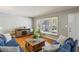 Comfortable living room featuring hardwood floors, neutral walls, and a cozy seating area perfect for relaxing at 2419 Little John Se Trl, Marietta, GA 30067