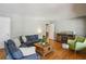 Bright living room with hardwood floors, comfortable blue sofas, and stylish decor creating a welcoming space at 2419 Little John Se Trl, Marietta, GA 30067