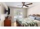 Bedroom with hardwood floors, a ceiling fan, and a window that allows in natural light at 30 Dogwood Trl, Dallas, GA 30157