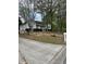 Ranch style house with new roof, covered porch, white siding, and driveway at 30 Dogwood Trl, Dallas, GA 30157