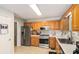 Efficient kitchen with stainless steel appliances, lots of cabinet space and a light tile floor at 30 Dogwood Trl, Dallas, GA 30157