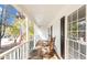 Inviting covered front porch with rocking chairs, perfect for relaxing and enjoying the outdoors at 30 Dogwood Trl, Dallas, GA 30157