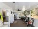 Sunroom with lots of windows, ceiling fan, room for a refrigerator, and light-colored walls at 30 Dogwood Trl, Dallas, GA 30157