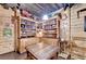Basement features wood walls, shelves with decor, and a table with benches at 3230 Riverhill Ct, Cumming, GA 30041
