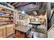 Basement entertaining space features a pool table, bar and exposed wood ceiling at 3230 Riverhill Ct, Cumming, GA 30041