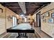Basement features a pool table, wood walls, wood ceiling, and natural lighting at 3230 Riverhill Ct, Cumming, GA 30041