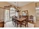 Charming dining room featuring large windows and an elegant chandelier at 3230 Riverhill Ct, Cumming, GA 30041
