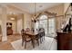 Well-lit dining area with hardwood floors and traditional furnishings, perfect for Gathering meals at 3230 Riverhill Ct, Cumming, GA 30041