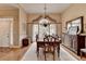 Dining room featuring a decorative chandelier and a large window at 3230 Riverhill Ct, Cumming, GA 30041