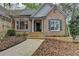 Charming brick home featuring a stone walkway, well-maintained landscaping, and a welcoming front entrance at 3230 Riverhill Ct, Cumming, GA 30041
