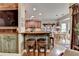 Kitchen with bar seating, stainless appliances, modern countertops and view of breakfast nook at 3230 Riverhill Ct, Cumming, GA 30041