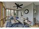 Inviting screened porch with comfortable seating and wooded views for peaceful relaxation at 3230 Riverhill Ct, Cumming, GA 30041