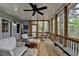 Charming screened porch with relaxing seating and expansive views of lush greenery at 3230 Riverhill Ct, Cumming, GA 30041