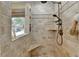 Modern shower with tiled walls, built-in bench, and sleek fixtures at 3230 Riverhill Ct, Cumming, GA 30041