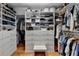 Organized walk-in closet featuring custom shelving, drawers, and ample storage space for shoes and clothing at 3230 Riverhill Ct, Cumming, GA 30041