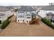 Aerial view of a home with a large backyard, deck, and neighboring houses in a residential community at 4495 Alister Park Dr, Cumming, GA 30040