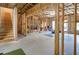 Unfinished basement with exposed beams, stairs, and a ping pong table for potential recreational space at 4495 Alister Park Dr, Cumming, GA 30040