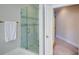 Modern bathroom with a glass-enclosed shower and decorative tiling detail at 4495 Alister Park Dr, Cumming, GA 30040