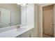 Bright bathroom featuring a white countertop, cabinetry, and shower with a neutral-toned shower curtain at 4495 Alister Park Dr, Cumming, GA 30040
