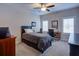 Comfortable bedroom with neutral walls and decor and a ceiling fan at 4495 Alister Park Dr, Cumming, GA 30040