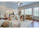 Spacious living room with lots of natural light, hardwood floors and open view to the kitchen at 4495 Alister Park Dr, Cumming, GA 30040