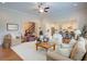 Open concept living room with hardwood floors, neutral paint colors and adjoined eat-in kitchen at 4495 Alister Park Dr, Cumming, GA 30040