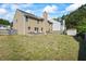 Large backyard with a patio sitting area and a small shed in the back at 543 Walnut Way, Palmetto, GA 30268