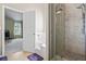 Bathroom including glass enclosed shower with marble tile work and separate bathtub at 543 Walnut Way, Palmetto, GA 30268