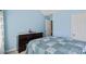 Comfortable bedroom with a large bed, soft blue walls, and open closet area, creating a peaceful retreat at 543 Walnut Way, Palmetto, GA 30268