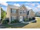 Charming two-story brick home with landscaped front yard and inviting entrance at 543 Walnut Way, Palmetto, GA 30268