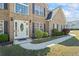 Close-up of the front door showcasing the landscaping and the home's brick facade at 543 Walnut Way, Palmetto, GA 30268