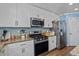 Well-appointed kitchen with granite countertops, stainless steel appliances, and ample cabinet space at 543 Walnut Way, Palmetto, GA 30268
