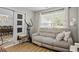 Cozy living room with a sofa and a view into the adjacent dining area at 543 Walnut Way, Palmetto, GA 30268
