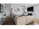 Open-concept living room featuring a fireplace, large sectional sofa, television and modern decor at 543 Walnut Way, Palmetto, GA 30268